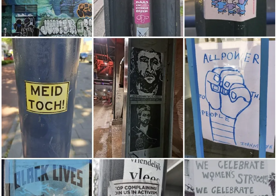 activistische stickers op straatmeubilair 